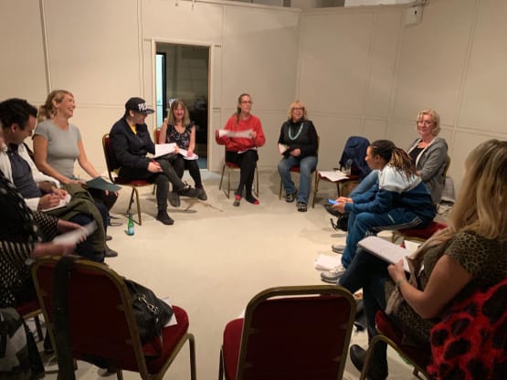 Workshop participants sharing their original stories